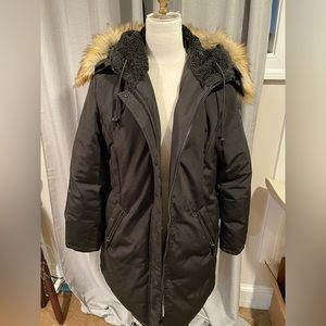 Super warm winter coat. Removable faux fur hood trim, multiple front pockets.